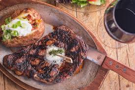 Wrap up and place in oven. Tf The Horseshoe Grill Rib Eye Steak Loaded Baked Potato Salad Red Wine 0069 Tucson Foodie