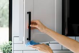 Mix together 1 cup (240 ml) of white vinegar with 2 cups (480 ml) of warm water. Tips For Cleaning Food Grease From Wood Cabinets