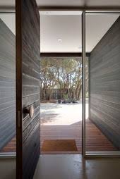Stained Black Timber Wall Concrete Floor Copper Fixings Brick Building Scandinavian Front Doors