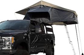 Truck bed tents are available in different sizes, colors, and even shapes. Amazon Com Overland Vehicle Systems Nomadic 4 Extended Roof Top Tent Dark Gray Base With Green Rain Fly Black Cover Universal Automotive