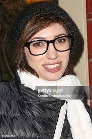 Television reporter Nadia Crow wearing H&M boots is seen at the 2014...  News Photo