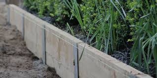 The Surewall System Is The New Look And Way Of Building Retaining Walls This Innovative Landscaping Retaining Walls Sloped Backyard Landscaping Retaining Wall