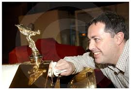 17206818-A very rare Gold Plated Rolls Royce one of only two in the world  has been delivered to a Glasgow Car showroom. Pictures Mark Gibson 06. 12.  04 Pictured David Reid Director