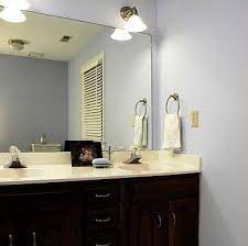 The mirror is easy to hang with. Before After Bathroom Mirror Makeovers Hooked On Houses