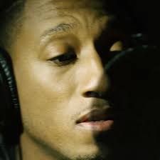 File:Lecrae recording with headphones and microphone.jpg