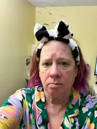 Hand washing dude isn't thrilled about hanging around the porta potties.