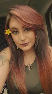 Can someone remove my earrings from this photo for a professional headshot?