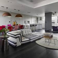 Some people love the idea of sofas so that there is potential for stretching out and lounging. Having A Sofa In The Middle Of The Living Room Is The Latest Trend