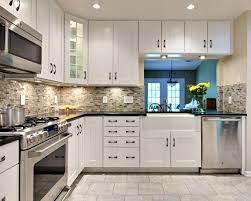 The kitchen offers a rough wood counter surrounding a double basin farmhouse sink with painted white cabinetry. 20 Stunning Kitchen Backsplash Design Ideas