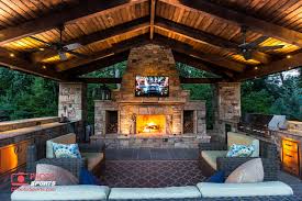 The project included an outdoor kitchen with equipment by lynx, and finished with emperador light marble and a spanish stone on walls. A Pavilion With An Outdoor Kitchen Fireplace And An Entertainment System Backyard Fireplace Outdoor Covered Patio Outdoor Pavilion
