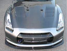Man in hood glasses and mask of balaclava sits at the computer laptop and downloads secret data. Top Secret Aero Vented Hood Frp For 2009 19 Nissan Gt R R35