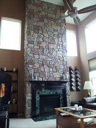 Our faux wood panels give the same rustic look as weathered wood but are easier to work with and can get wet. Dramatic Fireplace Transformation With Fieldstone Barron Designs
