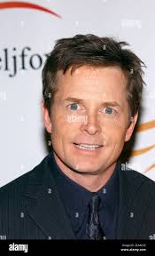 Actor Michael J. Fox poses for pictures as he arrives at the 2005 ""A Funny  Thing Happened On The Way To Cure Parkinson's..."" benefit evening for the  Michael J. Fox Foundation for