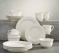 These white porcelain dishes feature a subtle beaded accent around their edges for a pop of texture. Emma Beaded Stoneware 16 Piece Dinnerware Set With Mug Cereal Bowl White Pottery Barn