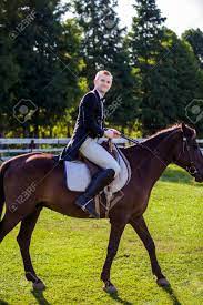 Shire horses have an excellent work ethic, a calm disposition, and are willing horses. Side View Portrait Of Man Riding Horse On Field Stock Photo Picture And Royalty Free Image Image 69408689