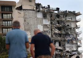 Rubble hangs from a partially collapsed building in surfside north of miami beach, on june 24, 2021. Roeux0m5teseim