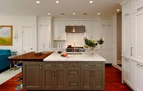Brown wooden french hood with corbels above a wolf range in a. Grey Brown Kitchen Ideas Photos Houzz