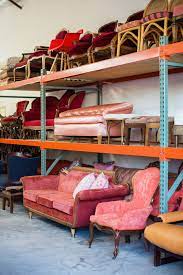 wedding and event rental company s warehouse with colorful vintage furniture in austin tex vintage furniture wedding rental furniture modern vintage furniture