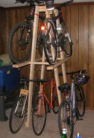 Bike racks for garage use are a great way of saving space and getting rid of clutter. This Is A Wooden Rack I Built To Store 5 Of My Bicycles It Is Constructed Of 2x4 And 2x2 Lumber Assembled With Kids Bike Storage Bike Storage Bicycle Storage