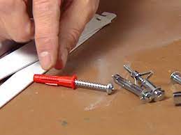 Then use a screwdriver to drive the anchor into the wall, which should naturally widen the size of the hole you've already drilled to accommodate the screw. How To Install Garage Shelving How Tos Diy