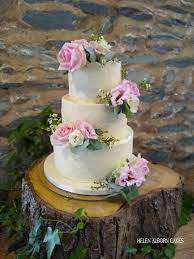 Rustic Buttercream Wedding Cake With Fresh Flowers Lemon With Freshly Made Lemon Curd Almond Wi Flower Cake Decorations Wedding Cake Display Fresh Flower Cake