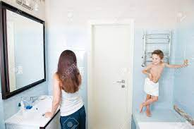 Mom watching son in shower