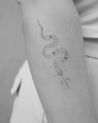 Do you want a traditional design or something more contemporary? Fine Line Snake Tattoo On The Forearm
