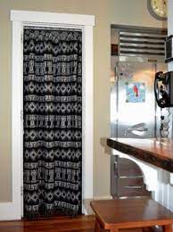 Fabric Cover Up 8 Great Makeovers Just Found What To Do W Those Annoying Laundry Room Doors Kitchen Pantry Doors Modern Bathroom Decor Master Bedrooms Decor