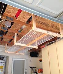 Diy Overhead Garage Storage Rack Four 2x3 S And Two 8 X16 Wire Shelves Less Than 50 Overhead Garage Storage Diy Overhead Garage Storage Diy Storage Rack