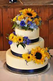 Minus The Light Blue Flowers And Add Purple And Fushia Flowers Sunflower Wedding Cake Wedding Cake Navy Sunflower Wedding
