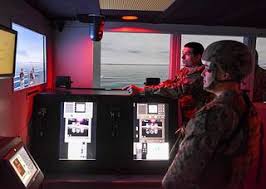 Gunner's Mate 1st Class Joshua Fredericks, left, and Master-at-Arms 2nd  Class Zachary Marley, both