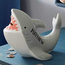 The piggy bank was from a giveaway at my uni and after watching waaaaay too much one punch man while painting it, it became tsundere. Personalized Shark Piggy Bank