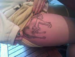 White girl gets tattoo of white girl sucking horse cock. : rtrashy