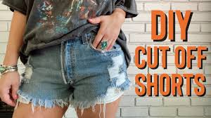 This cut doesn't need to be perfect because you won't be using the bottom half, and you'll be making more cuts to reach your desired length. Diy Distressed Denim Cut Off Shorts From Jeans Easy How To Tutorial Youtube
