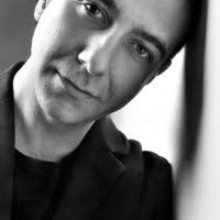 A man with glasses and a blue shirt. Alexandre padilha brazilian ministrry  of health.