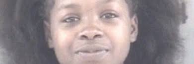 Two charged, one sought after woman pepper sprayed, struck at Albany store