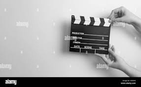 movie marker or clapper board set against a colorfull background Stock  Photo - Alamy