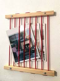 Colette Un Porte Revues Mural Astucieux Et Design Meubles Et Rangements Par Ako Design Porte Revue Mural Rangement Revues Porte Revue