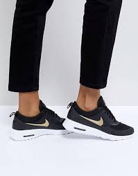 Featuring classic black and white trainers, as well as the latest vibrant nike air max, the collection contains all types of mens trainers, from running shoes to gym trainers to fashionable everyday trainers. Nike Air Max Thea Trainers In Black And Gold Asos