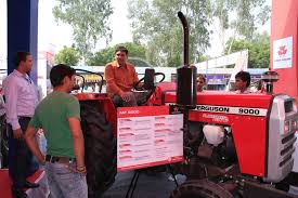 The Mf 9000 Planetary Plus Tractor From Tafe On Display For The Guests To Get A Feel Of The Perfection Cloaked In Red Tractors Farm Equipment Monster Trucks