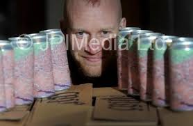 39396359-Sam Teale from Brass Castle Brewery, Malton looks at the Cans  which the labels peal off to reveal treasure spots. . 10th December 2018. .  Picture by Simon Hulme