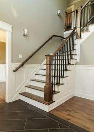 Staircase with iron spindles and gray herringbone. Pin On Home Inspiration