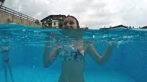 We review the best gopro drones and the alternative gopro camera drones you should consider before buying a gopro if you own a gopro already, or need a drone that supports (can carry) a gopro the potensic d85 fpv is the best drone. Young Girl Having Fun Swimming Pool Smiling Camera Mouth Open Video By C Zefart Stock Footage 262295822