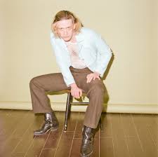 Press a button, and the couch changes to a bed. Cosmic Crooner Honey Harper On Finding The Right Cowboy Hat