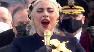 During the performance, fans flocked to twitter to fire off some hilarious tweets referencing just how well her outfit resembled the hunger games aesthetic. The Hidden Meaning Behind Lady Gaga S Inaugural Dress Youtube