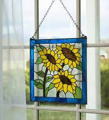 Having sunflower decorations around your home is bringing nature and joy to your abode all year round as the sunflower itself is a happy flower, always smiling. Stained Glass Sunflowers Panel Plowhearth