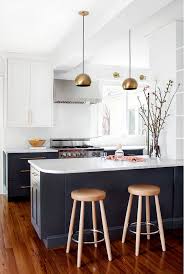 An open cookbook shelf stands over glass canisters filled with goodies. Two Toned Kitchen Renovation Design Ideas Home Bunch Interior Design Ideas