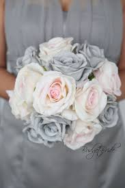 In keeping with the grey and pink wedding colur theme, the bride should stick with the traditional white wedding gown. Davids Bridal Blush Pink And Grey Theme Wedding Flower Brides Bouquet Mercury Silk Flowers Wedding Blush And Grey Wedding Wedding Bouquets Pink