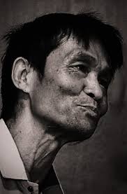 A portrait of renowned lyricist Doneshwor Konsam. 'Nanggisuni  Masi.Latnadana nungsina loubiyu leigi khutna, thambiyu nathammoigee leika  leiyonnungda.'