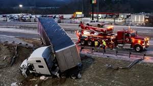 Frozen Mississippi: Trucks Slide Off Icy Roads